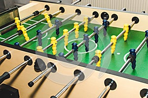 Table soccer. Game figures football players close up. An entertaining game for football fans.