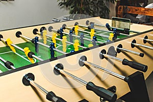 Table soccer. Game figures football players close up. An entertaining game for football fans.