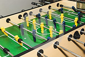 Table soccer. Game figures football players close up. An entertaining game for football fans.