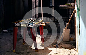 Table soccer in a yard with old buildings behind