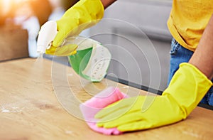 Table, spray and hands cleaning in a home for hygiene, germ protection and maintenance with a chemical in a house