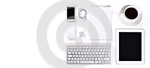 Table, studio or objects for office by white background or technology with stationary for professional job. Keyboard