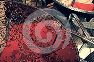 Table in the summer cafe with water drops