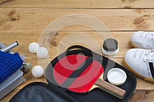 Table tennis paddle in open case with other mandatory equipment