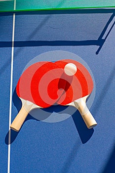 Table tennis ping pong two paddles and white ball