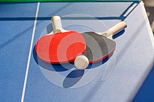 Table tennis ping pong two paddles and white ball photo