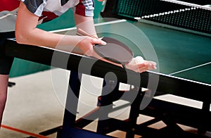 Table tennis player serving