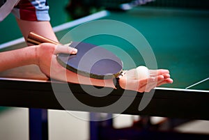 Table tennis player serving