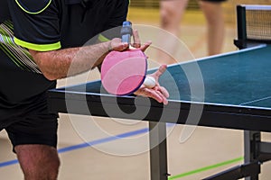 Table tennis player serving