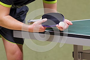 Table tennis player serving