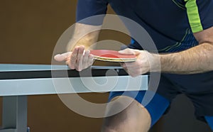 Table tennis player serving