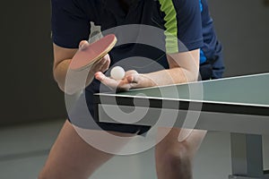 Table tennis player serving