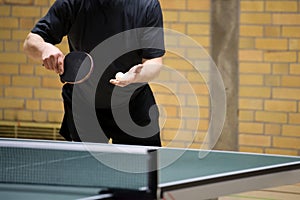 Table tennis player serving