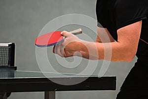 Table tennis player serving