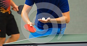 Table tennis player serving