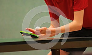 Table tennis player serving