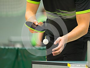 Table tennis player serving