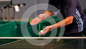 Table tennis player serving