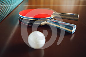 Table tennis rackets and ball, close-up view