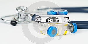 On the table there is a stethoscope, injections and a sign with the inscription - cardiac ischemia photo