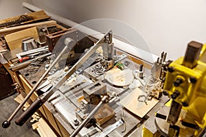 A table with tools and a piece of wood