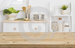 Table top with blurred kitchen furniture as background