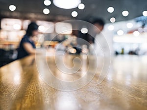 Table top with blurred people in cafe background