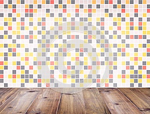 Table top over colorful mosaic wall background.