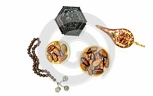 Table top view aerial image of decorations Ramadan Kareem holiday background.Flat lay date with rosary & aladdin lamp & arabic