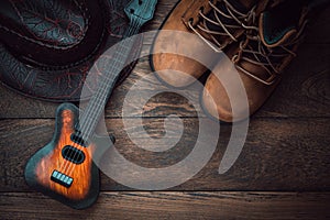 Table top view aerial image of music instruments & clothing background concept.