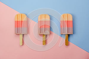 Table top view aerial image of sign or food of summer season holiday background concept.Flat lay of pastel ice cream on modern