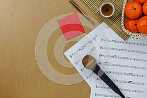 Table top view of music sheet note and accessories Chinese new year & Lunar festival concept.