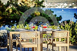 A table in a Turkish restaurant overlooking the sea in the summer sun.