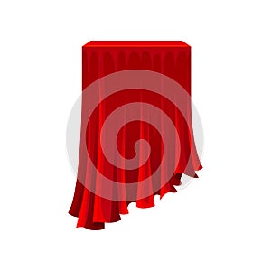 Table under red silk cloth on white background.