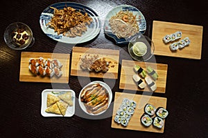 Table with a variety of Japanese food dishes