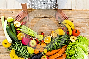 Table view of coloured mix of fresh and seasonal fruits and vegetables for vegan or vegetarian or just heathy food - diet and