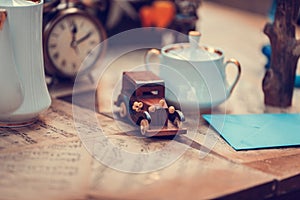 Table with wedding autumn decor - candles, books, clocks, flowers, notes