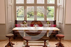 Table with window seating in country hotel, pub or bar