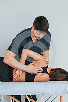 On the table. Woman visiting physiologist that making massages and helping with traumas