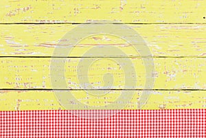 Tablecloth red checked on rustic table surface with copy space