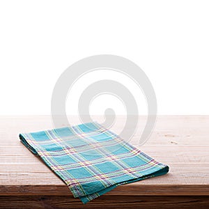 Tablecloth on wooden deck table, white background.
