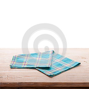 Tablecloth on wooden deck table, white background.