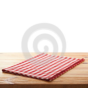 Tablecloth on wooden deck table, white background.