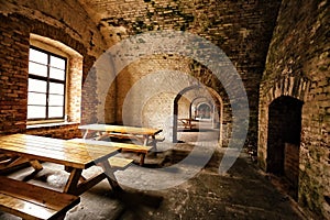 Tables and bench in the old arched military casern