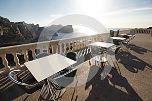 Tables of cafe at sunset on Cap de Formentor - beautiful coast of Majorca, Spain - Europe.