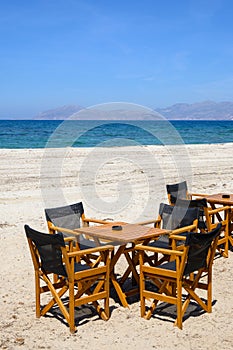 Tables and chairs on the beach. The island of Kos. Greece