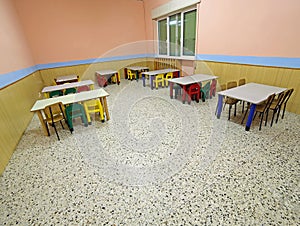 tables and chairs in the dining hall of a school