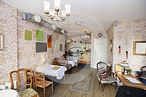 Tables and chairs in empty restaurant