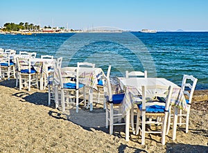 Table with chairs of a greek tavern. Kos, Greece.