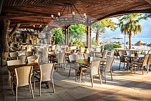 Tables and chairs in a hotel bar and sea view, Marmaris, Turkey
